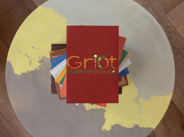 mockup-of-a-griot-publishing-house-book-on-a-pile-of-colorful-books